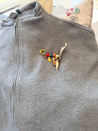 Handcrafted Gemstone & Charm Statement Pin with Tassel and Bow Accent