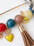 Handcrafted Gemstone & Charm Statement Pin with Tassel and Bow Accent