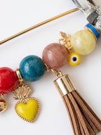 Handcrafted Gemstone & Charm Statement Pin with Tassel and Bow Accent