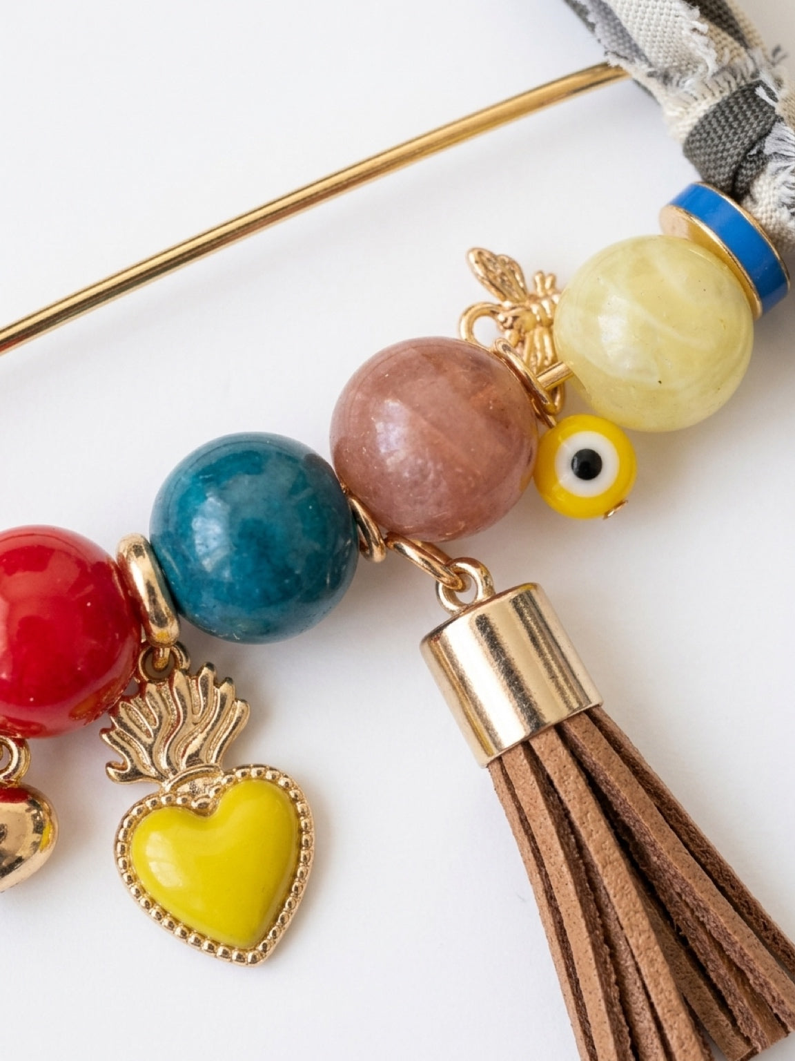 Handcrafted Gemstone & Charm Statement Pin with Tassel and Bow Accent